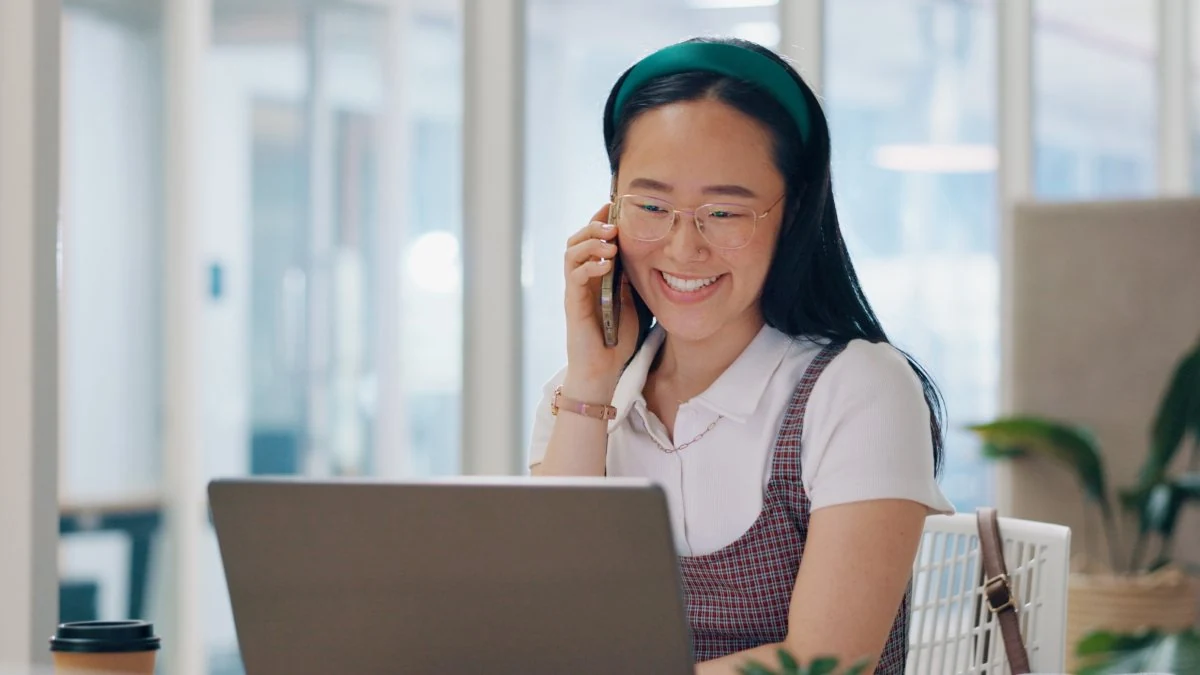 New sales hire on a call at her laptop