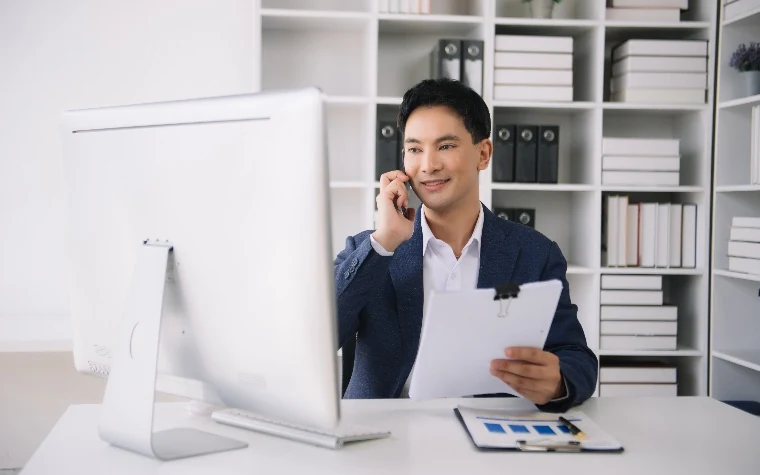SaaS sales rep reviewing notes during a call