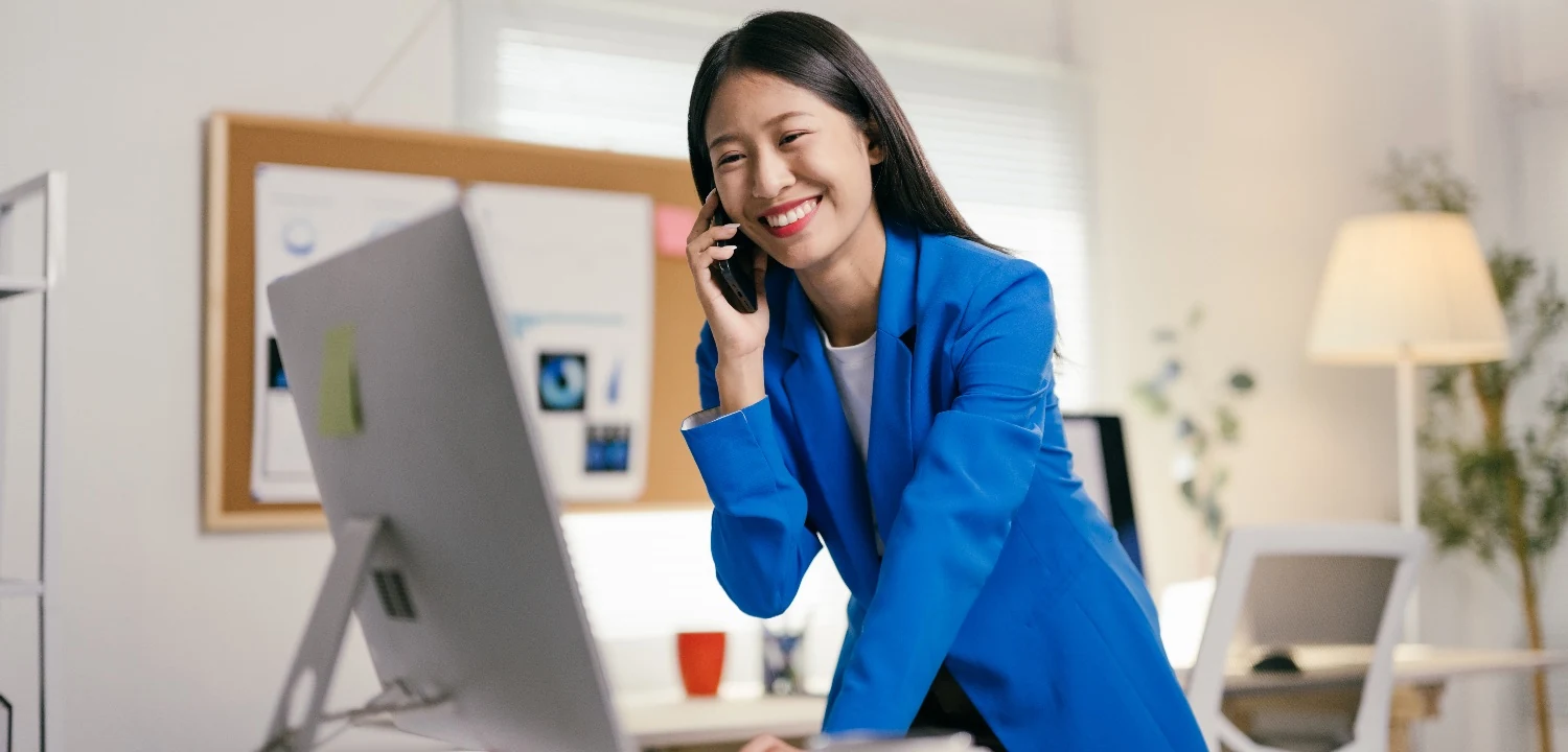 Sales rep smiling on a live customer call