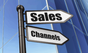 Directional sign with 'Sales' on the top arrow and 'Channels' on the bottom arrow against a blue background.